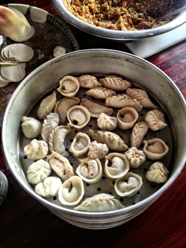 Momos! I had these a few times in Nepal. They are quite labor-intensive to prepare, but I learned how to do it! And they are addictive.