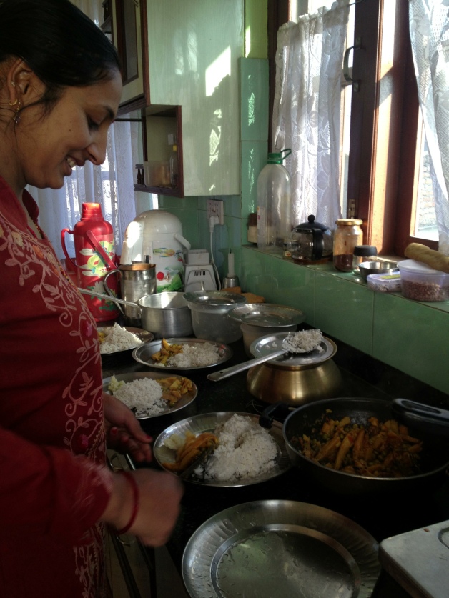 Aama serving (huge) normal helpings of rice and curried vegetables.